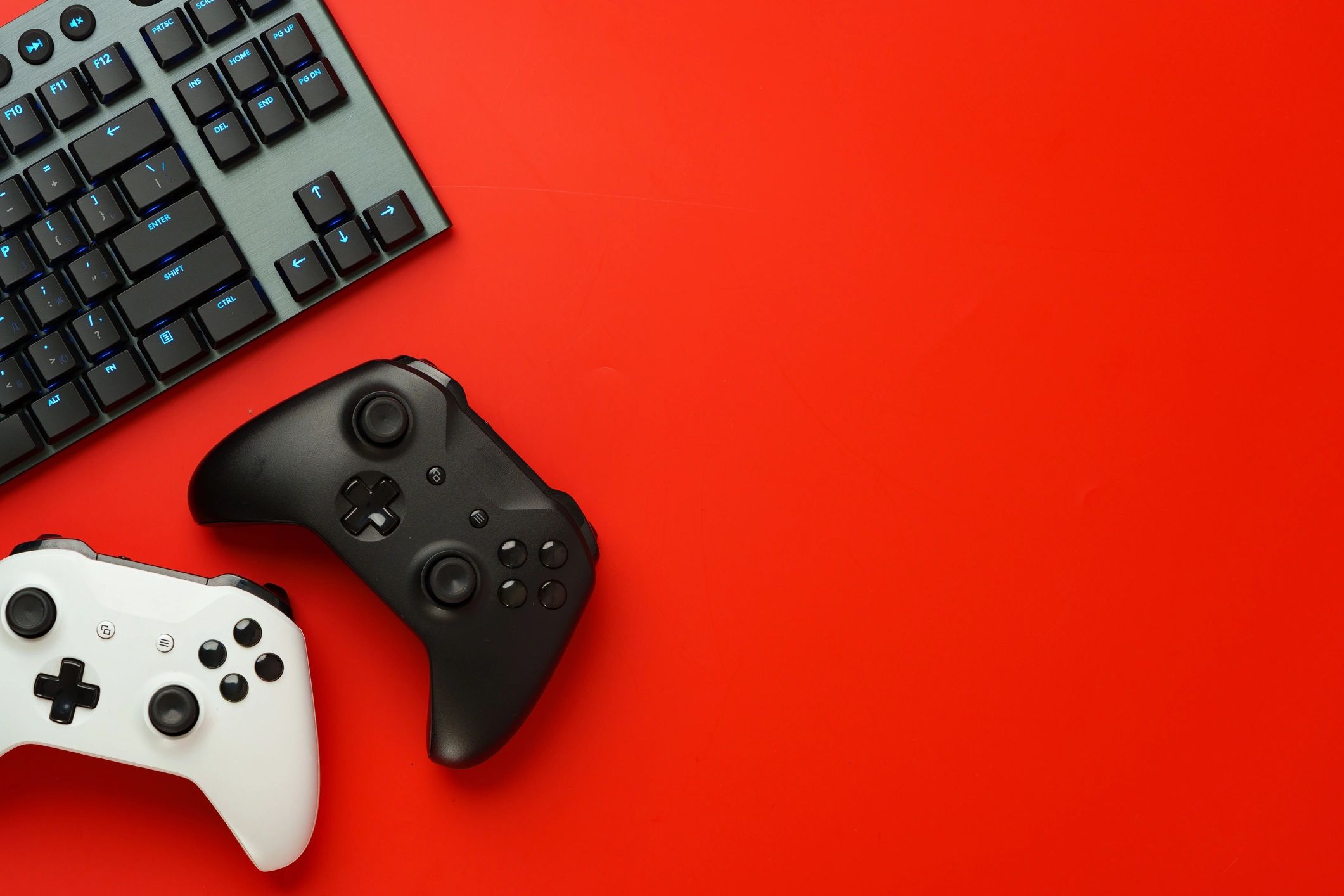 Gamer equipment on red background