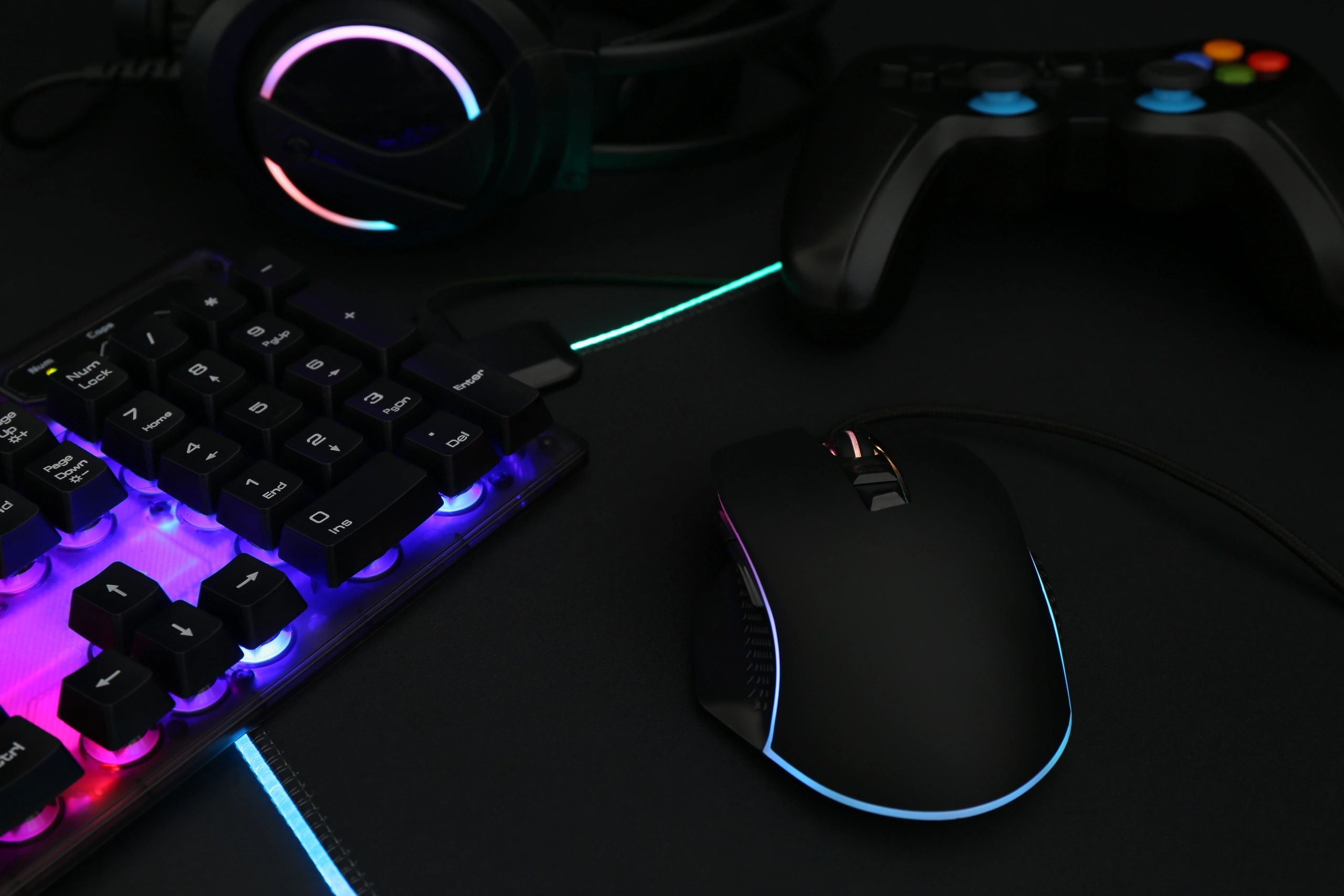 Game controller and RGB accessories on dark background